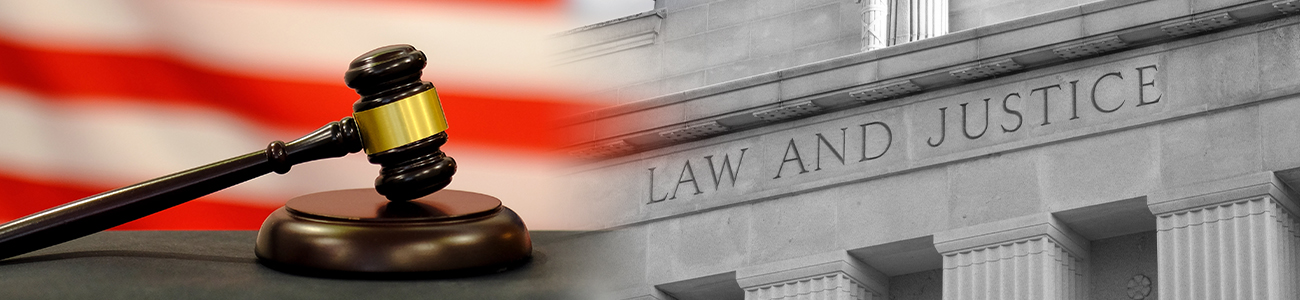  image displays a close-up of a wooden gavel set against a background with the American flag, alongside the engraved words 